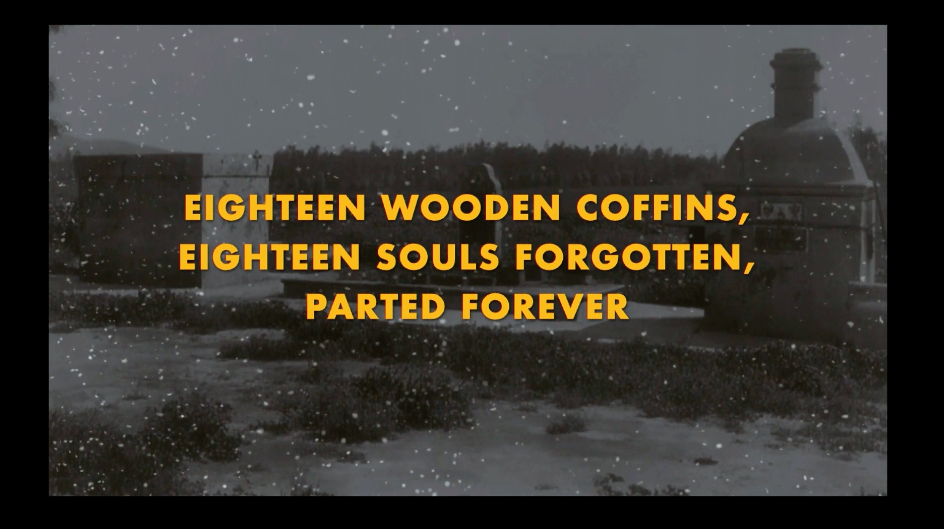 Projection still: Eighteen wooden coffins, eighteen souls forgotten