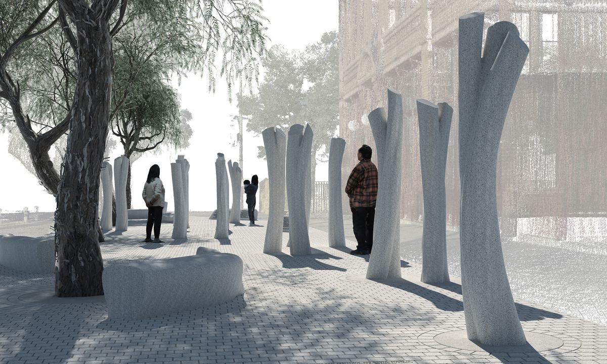Rendering of the planned memorial: tall granite trunks shaped like banyan trees stand along a paved sidewalk under pepper trees, with visitors walking among them